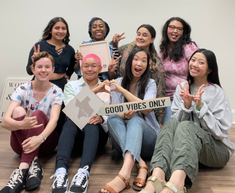 The team with a Good Vibes Only sign