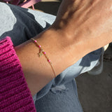Gold Cross Bracelet with Pink Accents