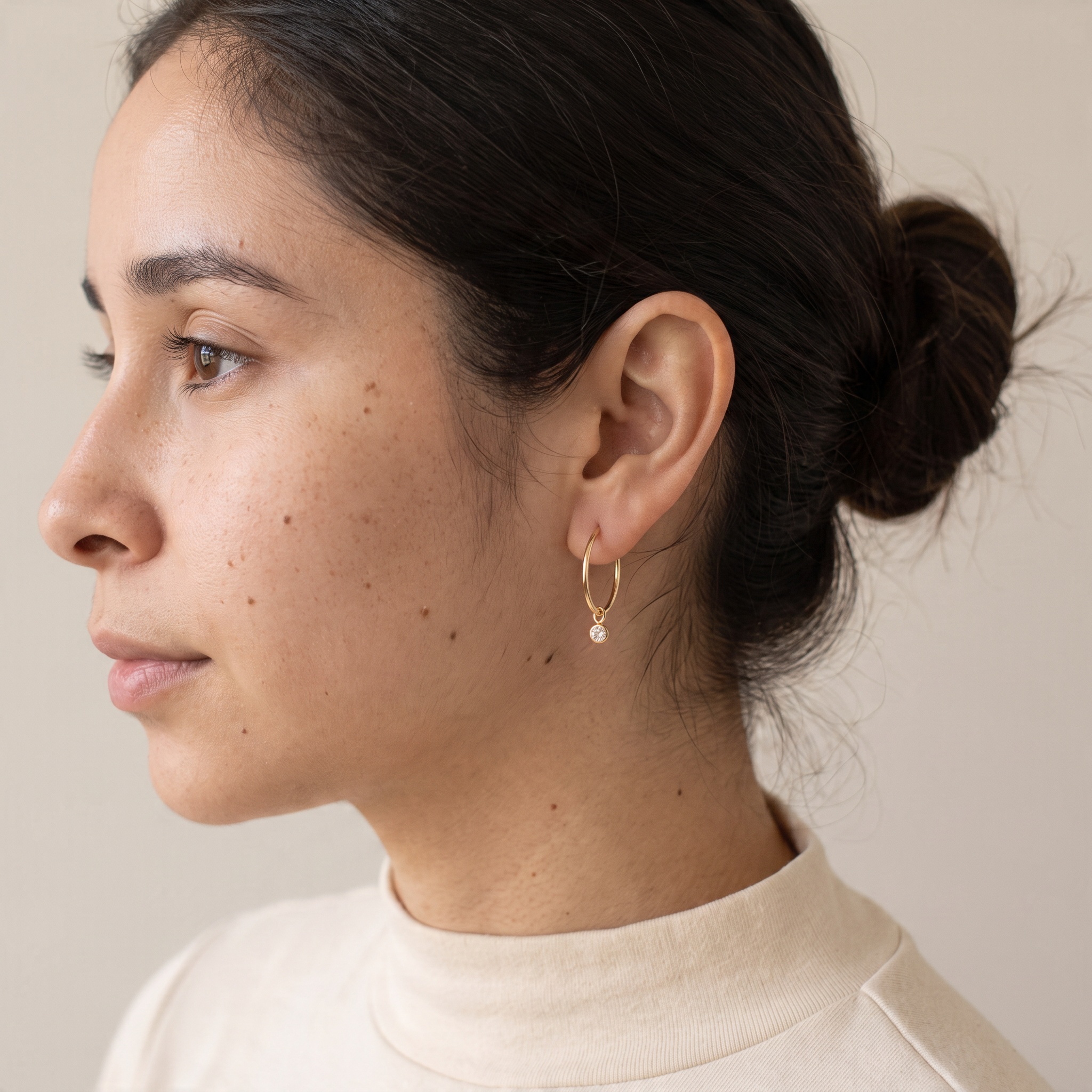Charm hoop earrings with a diamond cut CZ charm, 14k gold filled, worn, by Olivia Cactus