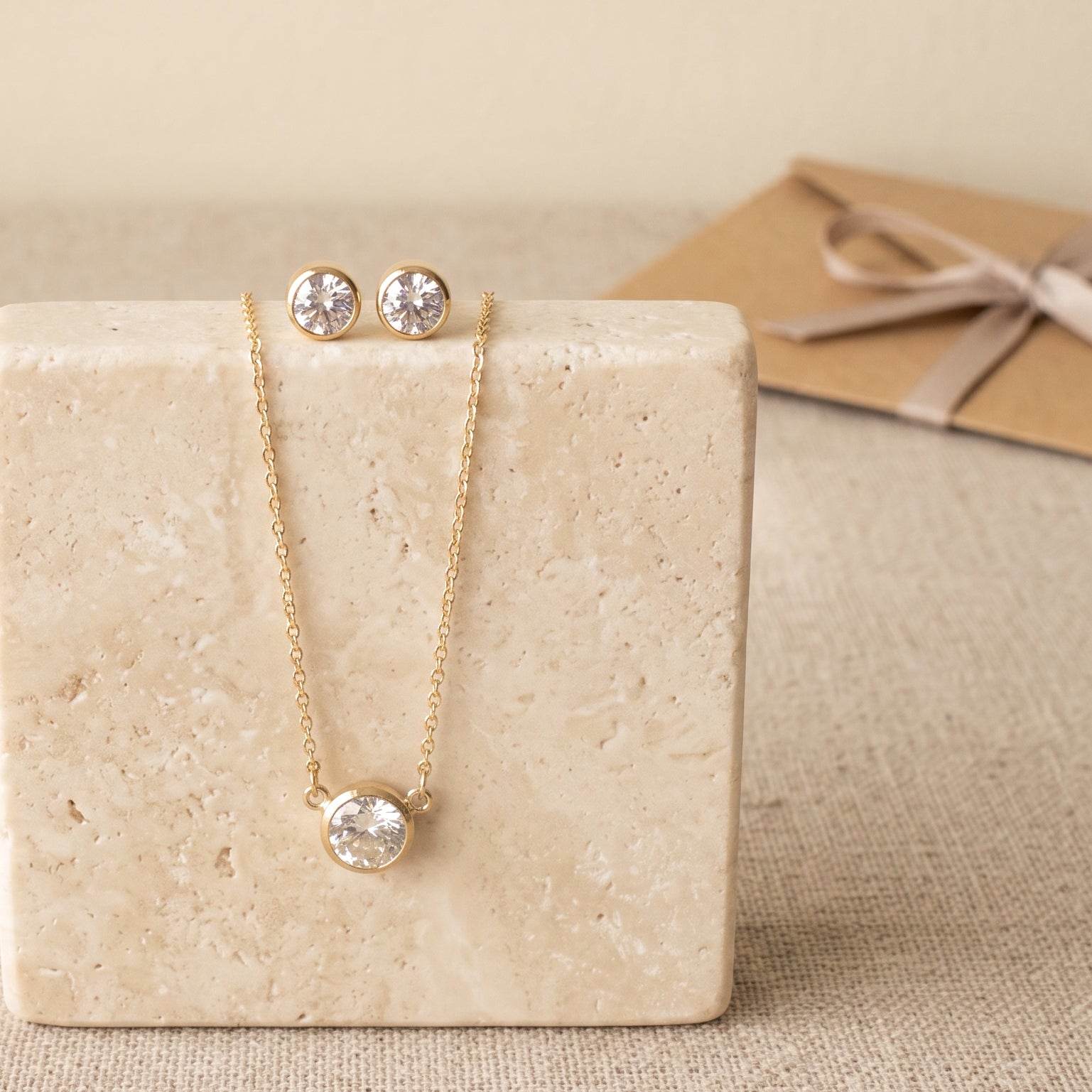 Solitaire necklace and CZ stud earrings gift set in 14k gold filled, on ivory stone, by Olivia Cactus