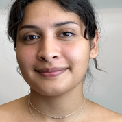 Model wearing the personalized Morse code necklace in bold sterling silver