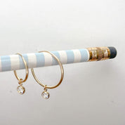 Hoop earrings with a diamond cut CZ charm, 14k gold filled