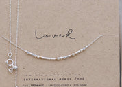 Dainty Silver Chain Loved Morse Code Necklace on a Brown Kraft Card Sowing Morse Code Dots and Dashes Matching the Delicate Chain